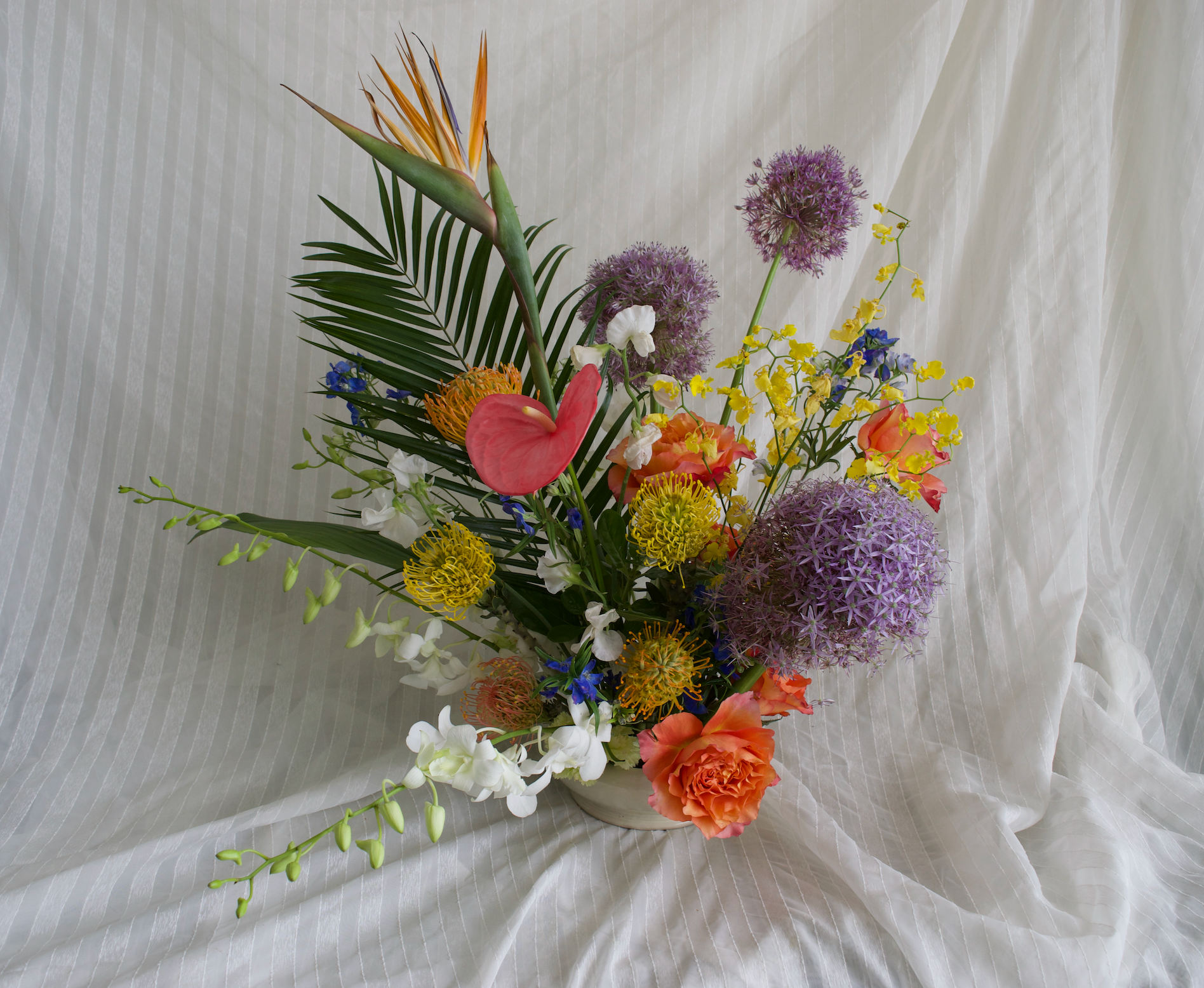 Large Tropical Floral Arrangement with Orchids, Allium, Anthurium, Roses, and Palm Fronds